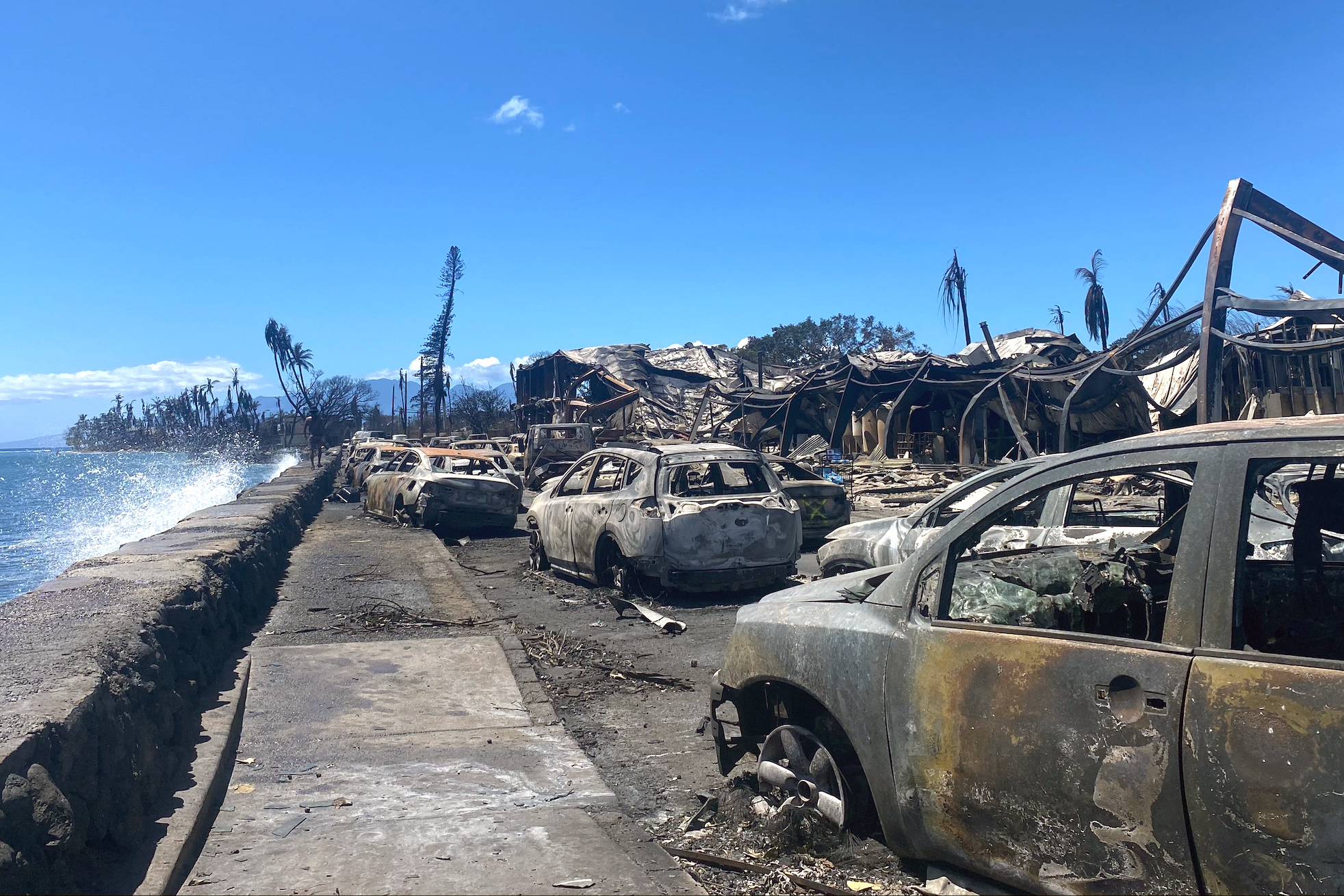 Burned cars and destroyed buildings are pictured in the aftermath of a wildfire in Lahaina, western Maui, Hawaii on August 11, 2023. Photo by PAULA RAMON/AFP via Getty Images